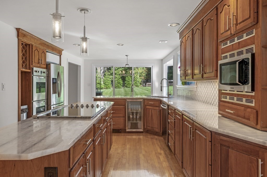 21 Porter Road Boxford, MA 01921 - Photo 14 of 42 a kitchen with stainless steel appliances granite countertop a sink and stove