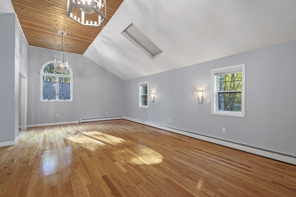 21 Porter Road Boxford, MA 01921 - Photo 29 of 42 a view of an empty room with wooden floor and a window