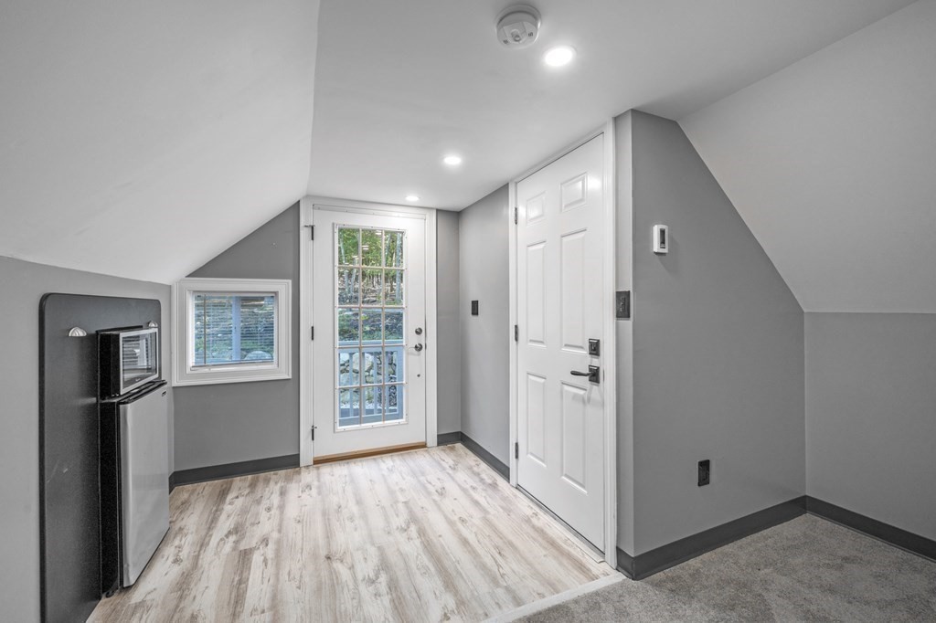 21 Porter Road Boxford, MA 01921 - Photo 37 of 42 wooden floor in an empty room with a window