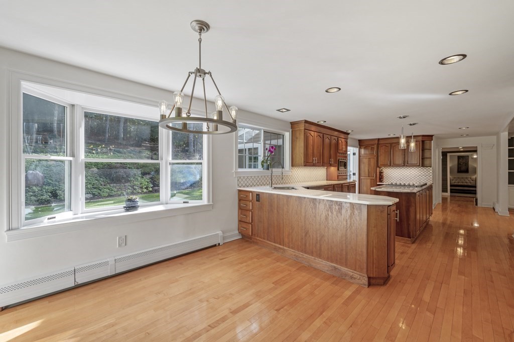 21 Porter Road Boxford, MA 01921 - Photo 5 of 42 a kitchen with stainless steel appliances granite countertop a stove and wooden floor