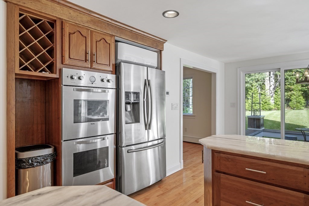 21 Porter Road Boxford, MA 01921 - Photo 7 of 42 a kitchen with stainless steel appliances granite countertop a refrigerator and a stove