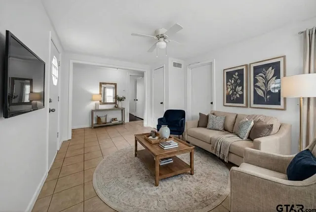 a view of a workspace with furniture and wooden floor