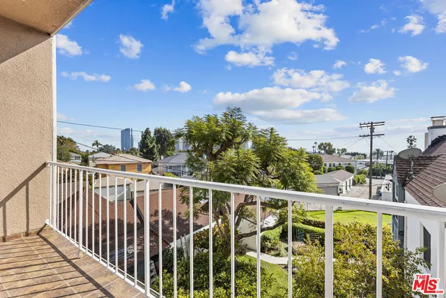 a view of a balcony with city view