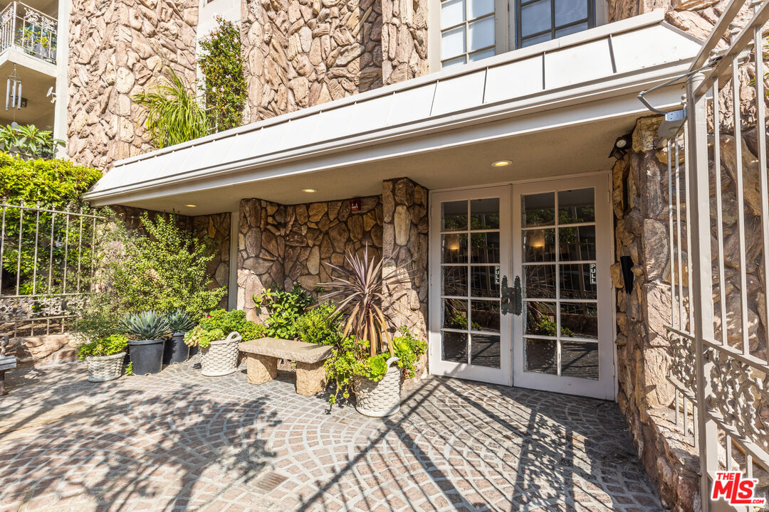 1260 South Beverly Glen Boulevard, Unit 305 Los Angeles, CA 90024 - Photo 2 of 28 a view of a two chairs in the patio