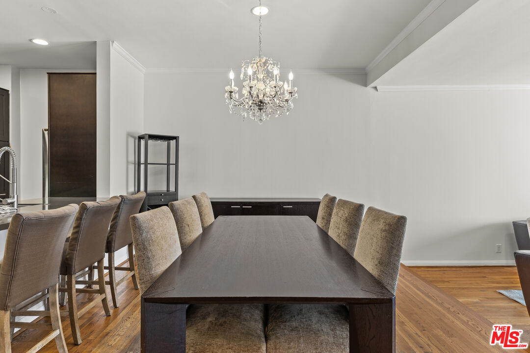 1260 South Beverly Glen Boulevard, Unit 305 Los Angeles, CA 90024 - Photo 9 of 28 a view of a dining room with furniture and wooden floor