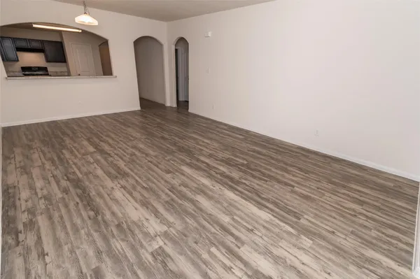 a view of a livingroom with wooden floor