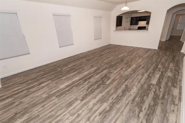 a view of a livingroom with wooden floor