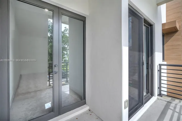 a bathroom with a glass shower door and a bathtub