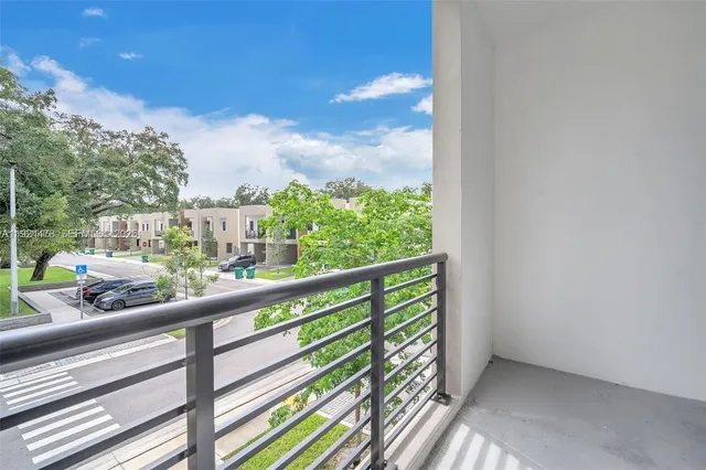 a view of balcony with furniture