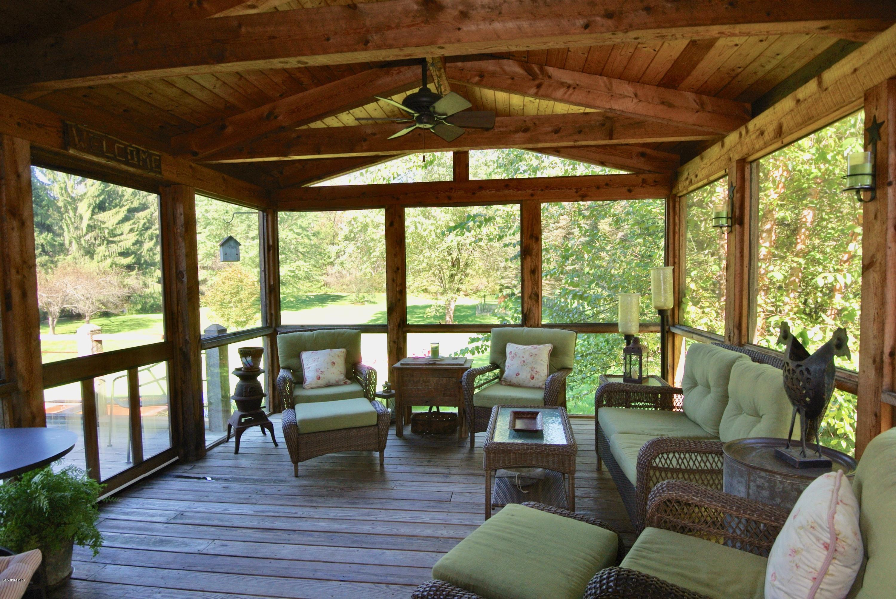 3136 State Road Richmond, MA 01254 - Photo 13 of 29 a living room with furniture and floor to ceiling windows