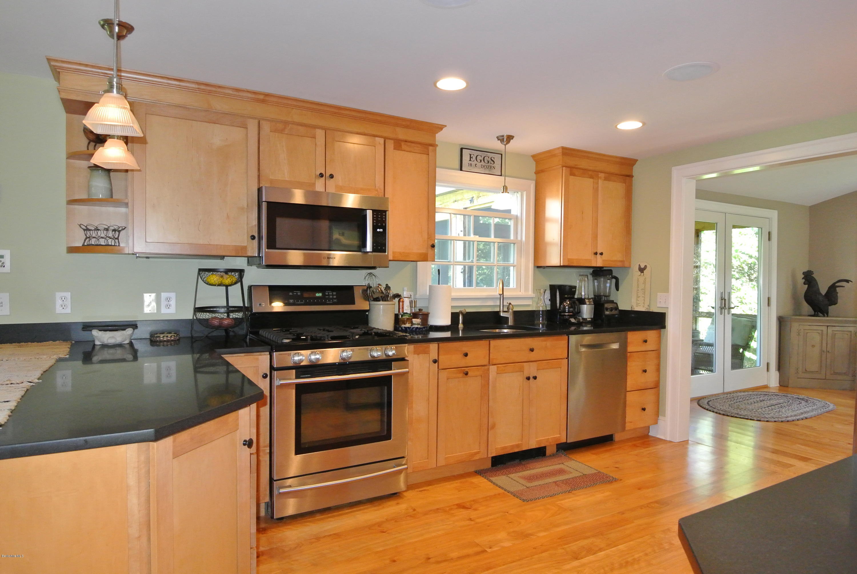 3136 State Road Richmond, MA 01254 - Photo 18 of 29 a kitchen with stainless steel appliances granite countertop a stove a sink and a microwave