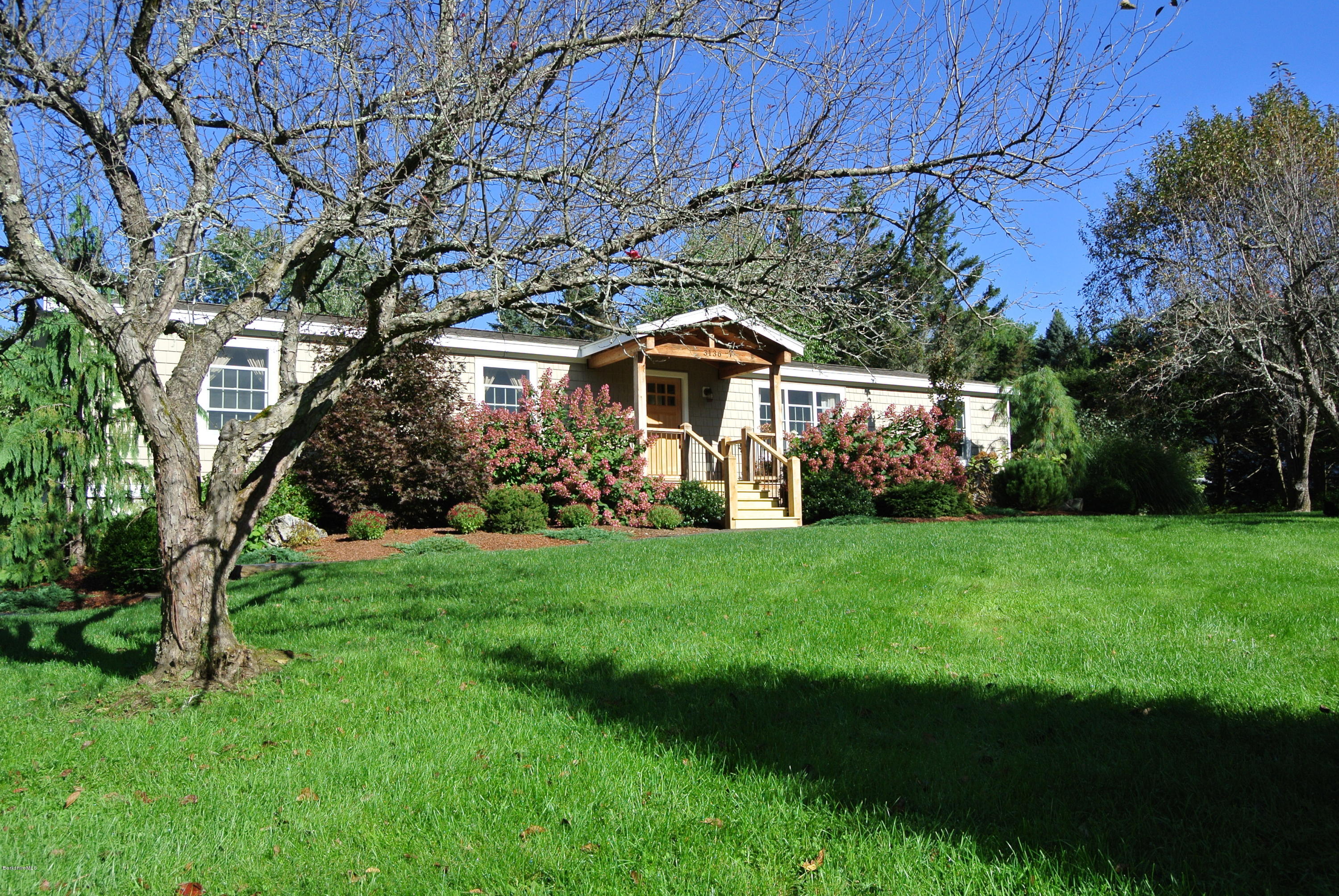 3136 State Road Richmond, MA 01254 - Photo 3 of 29 a front view of a house with garden