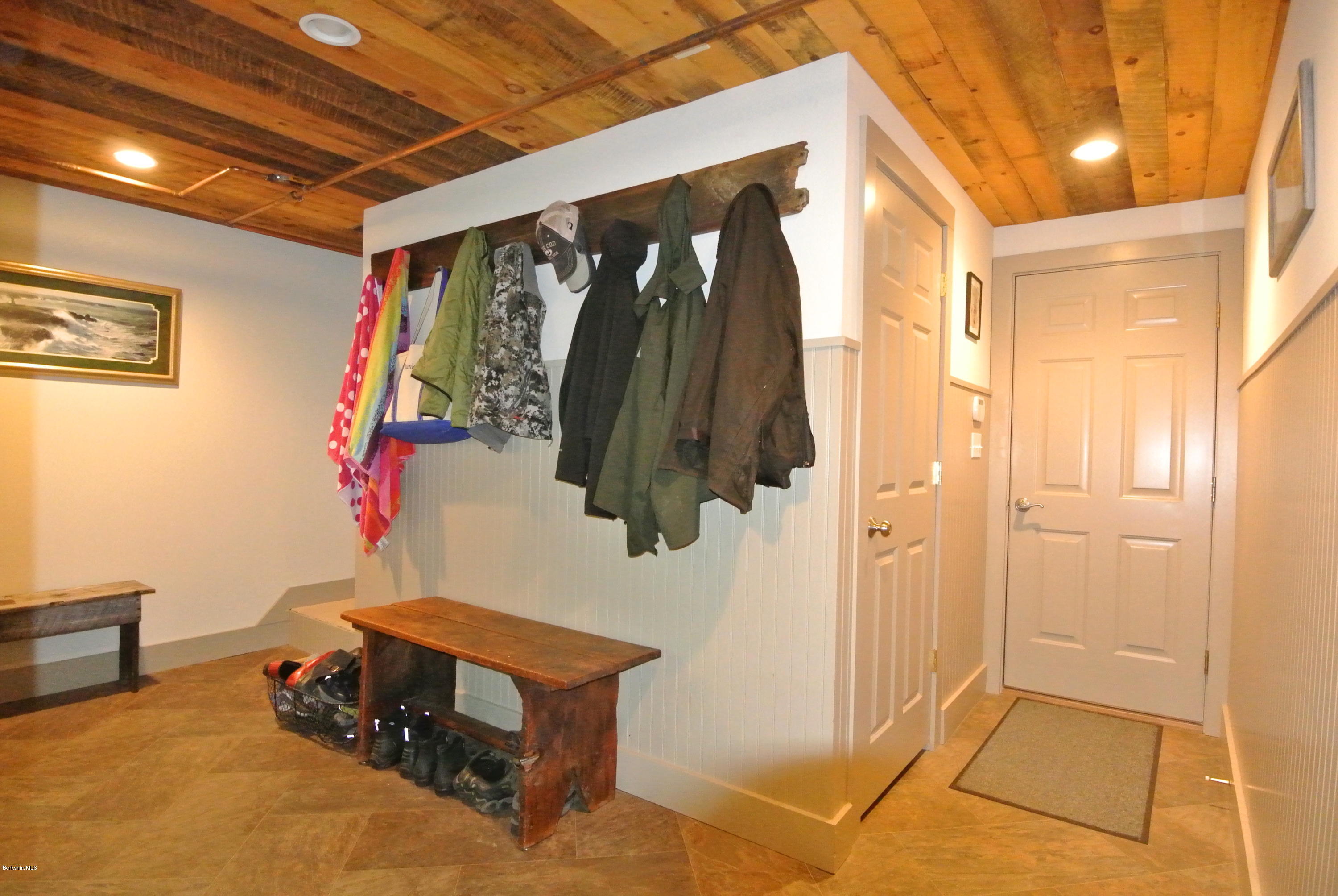 3136 State Road Richmond, MA 01254 - Photo 29 of 29 a living room with a baby bed furniture and a painting on the wall
