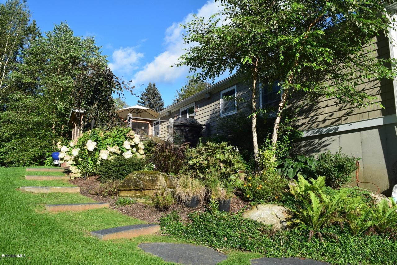 3136 State Road Richmond, MA 01254 - Photo 5 of 29 a front view of a house with a yard