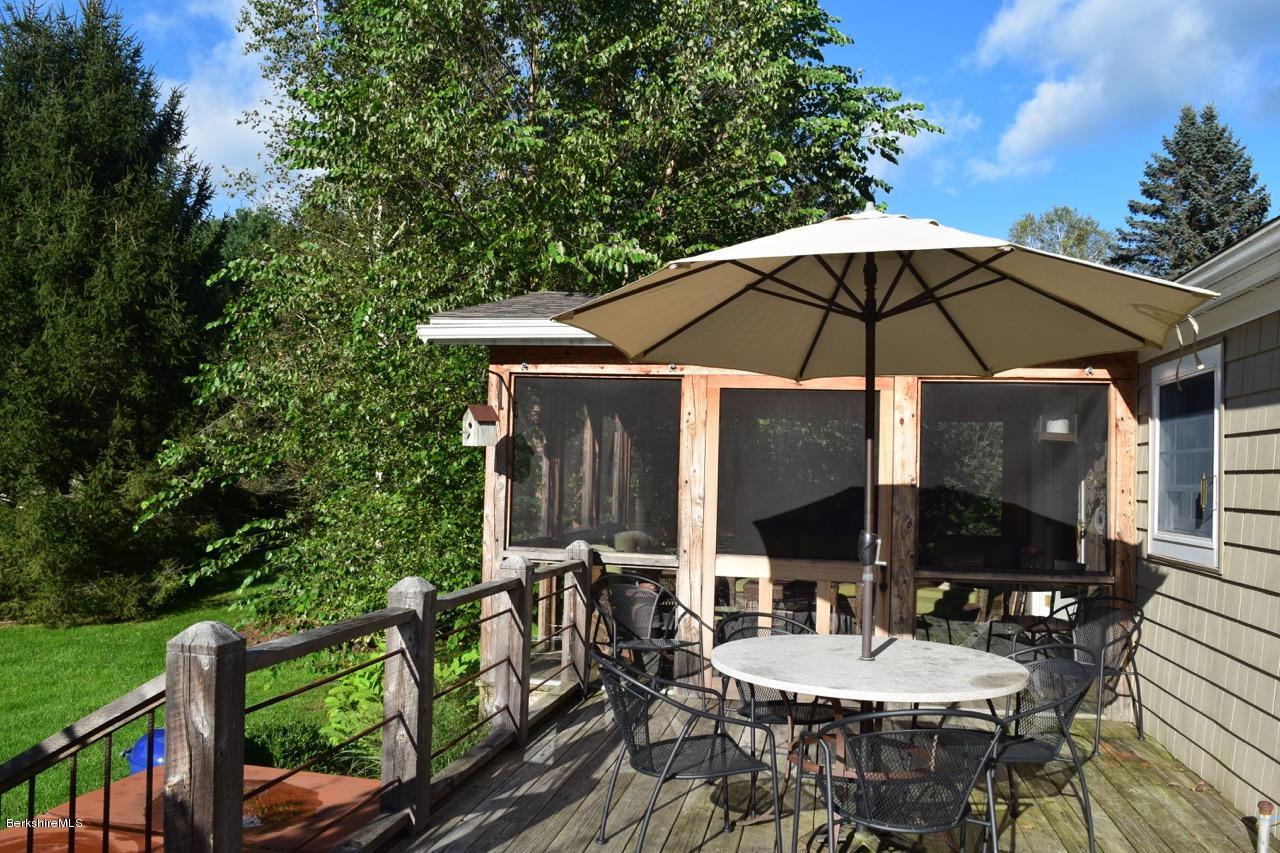3136 State Road Richmond, MA 01254 - Photo 6 of 29 an outdoor space with furniture and umbrella