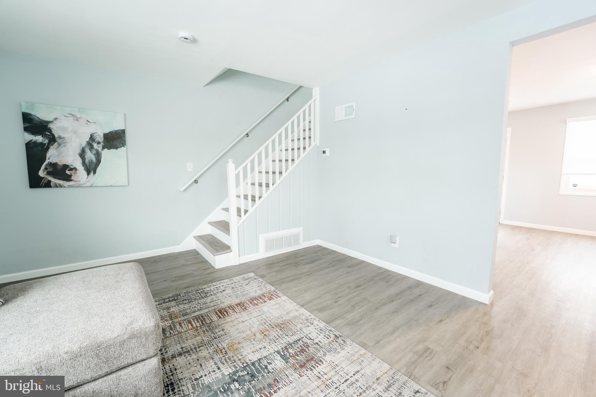 3410 Embry Street Silver Spring, MD 20902 - Photo 27 of 28 a view of entryway and hall with wooden floor