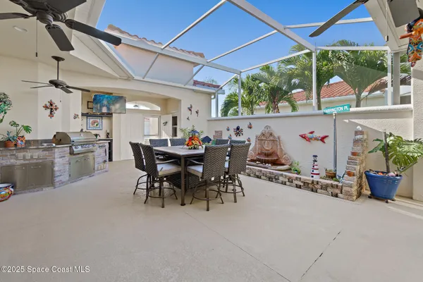 a kitchen with a sink appliances and cabinets