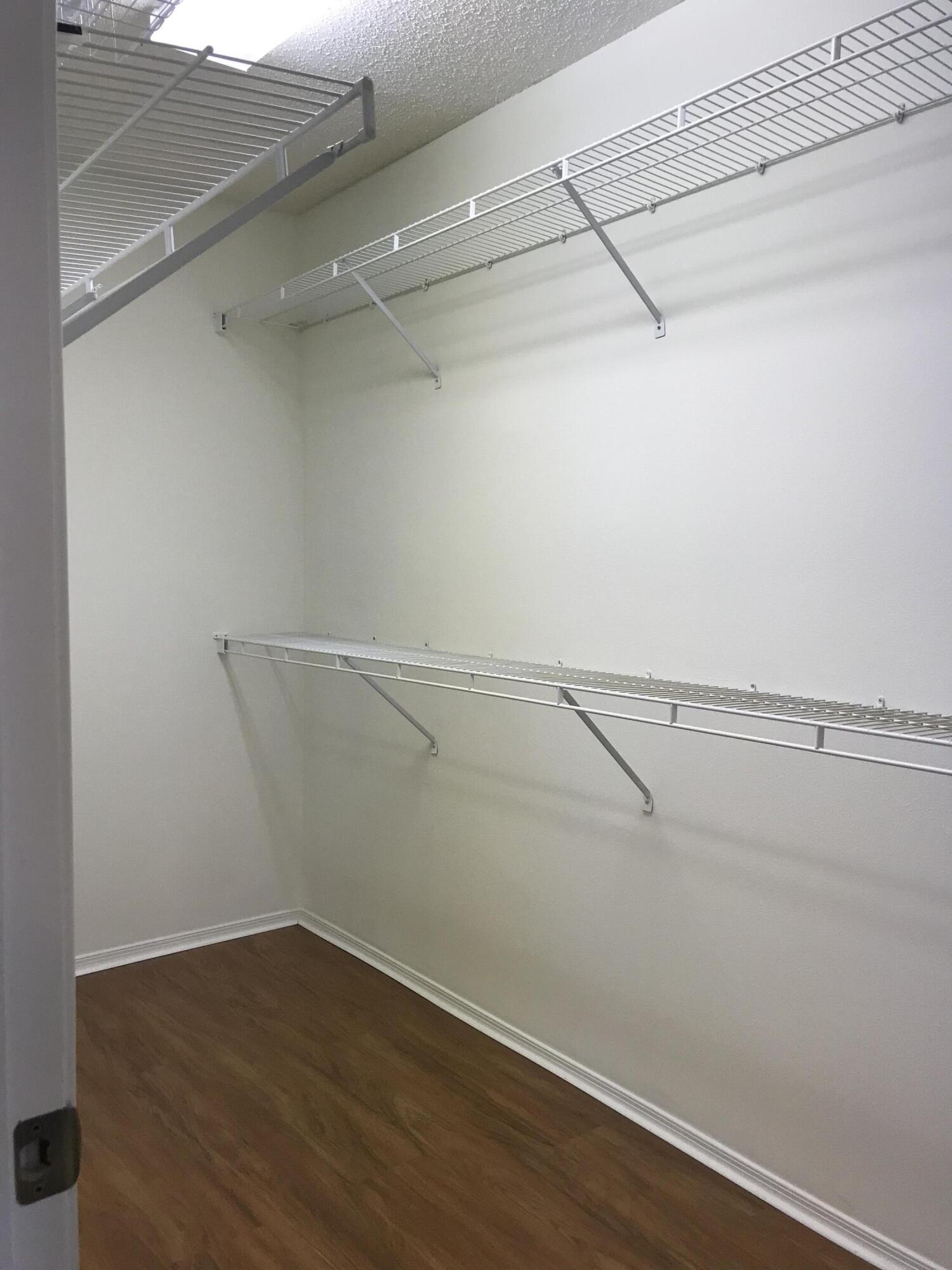 21551 St Andrews Grand Circle, Unit 39 Boca Raton, FL 33486 - Photo 17 of 19 huge Primary closets