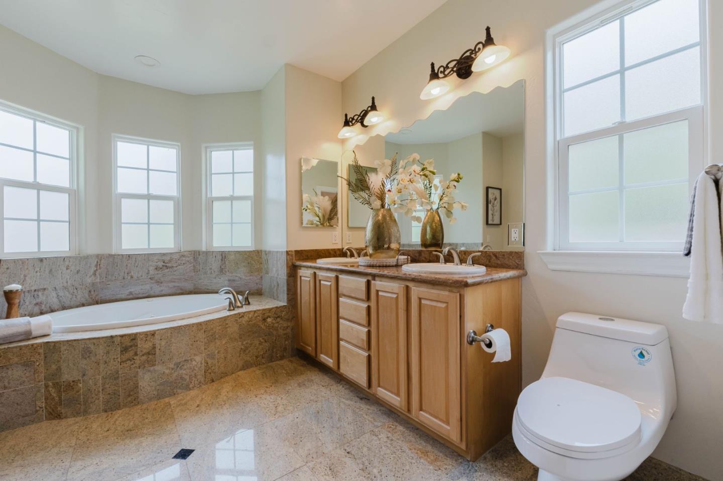 2748 Montavo Place Campbell, CA 95008 - Photo 13 of 31 a bathroom with a granite countertop sink a toilet a mirror and bathtub
