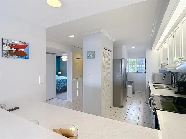 a living room with furniture a rug and a large window