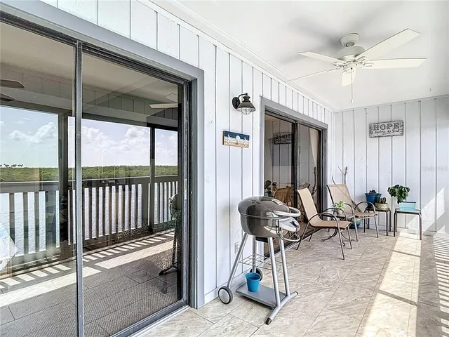 an aerial view of a house with a lake view