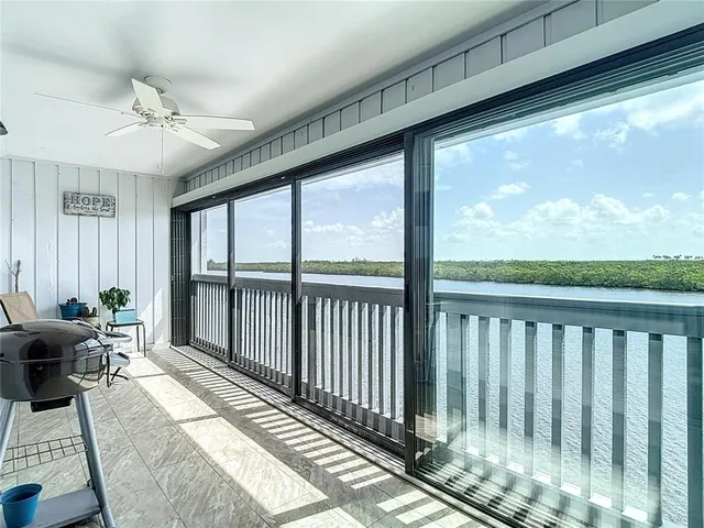 an aerial view of a house with a lake view