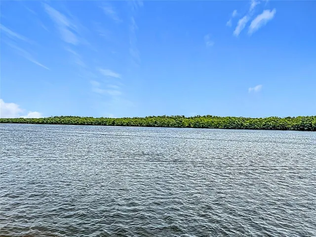 an aerial view of a house with a lake view