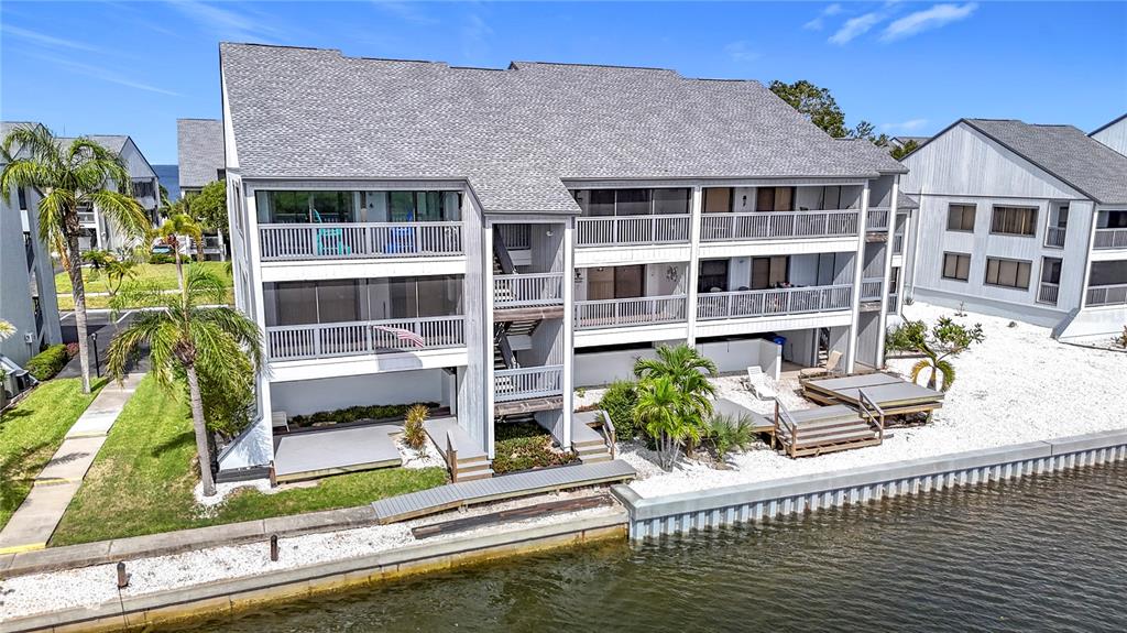 809 Bahia Del Sol Drive, Unit 72 Ruskin, FL 33570 - Photo 45 of 84 a house with tall trees in front of it