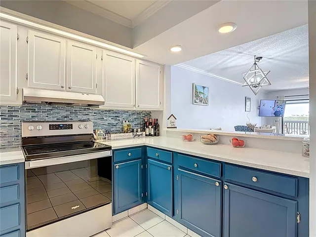 a kitchen with granite countertop cabinets stainless steel appliances a sink and dishwasher