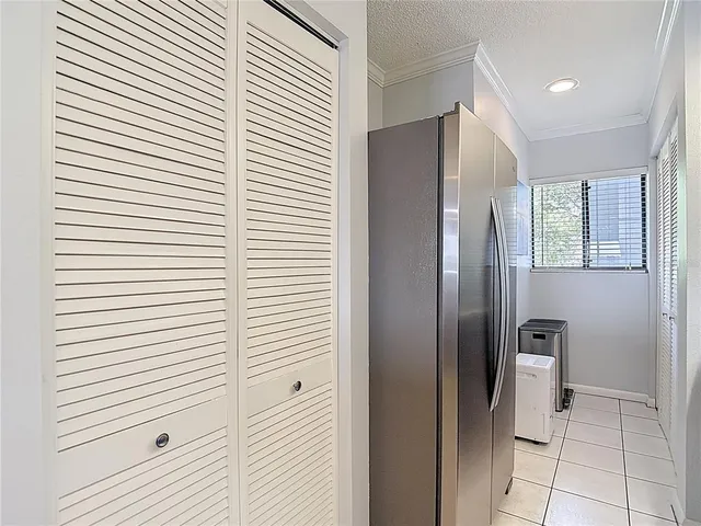 a kitchen with a sink a stove and cabinets