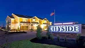 a sign that is sitting on the side of a building