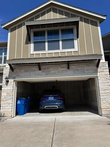 a front view of a house with garage