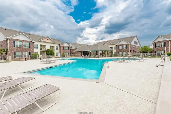 a view of multiple houses with a yard