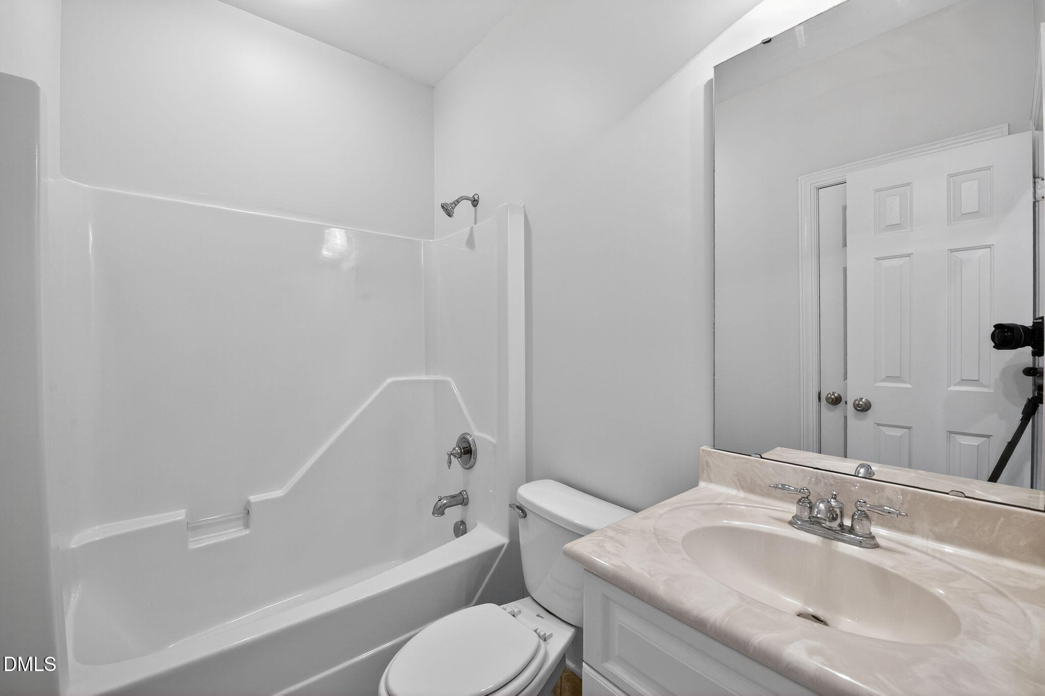 8725 Oregon Inlet Court Raleigh, NC 27603 - Photo 16 of 31 a bathroom with a sink toilet and shower
