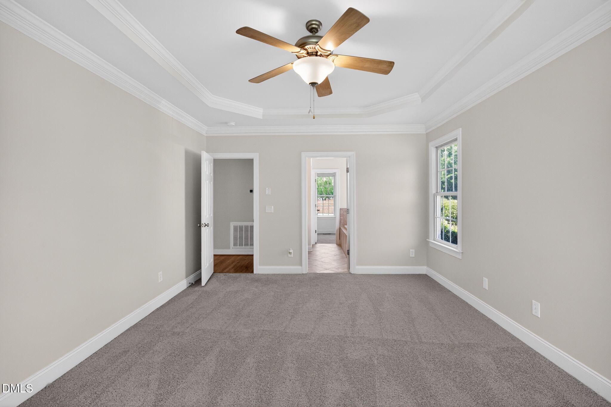 8725 Oregon Inlet Court Raleigh, NC 27603 - Photo 25 of 31 wooden floor in an empty room with a window