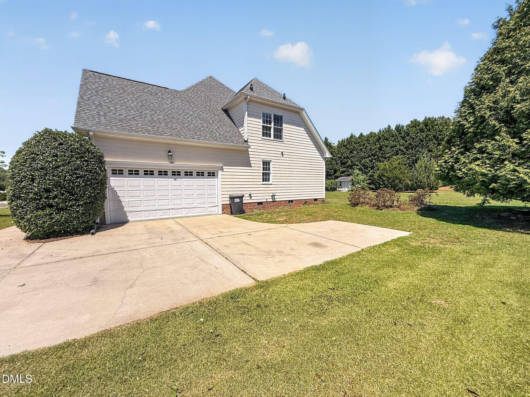 8725 Oregon Inlet Court Raleigh, NC 27603 - Photo 30 of 31 a view of backyard of a house