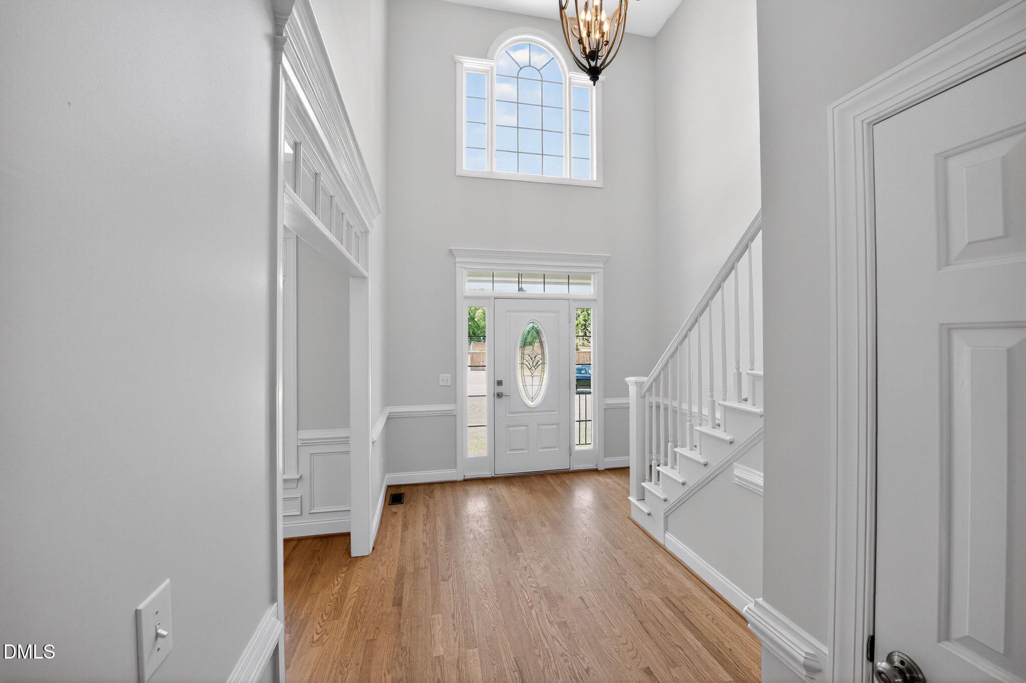 8725 Oregon Inlet Court Raleigh, NC 27603 - Photo 4 of 31 a view of entryway and hall with wooden floor