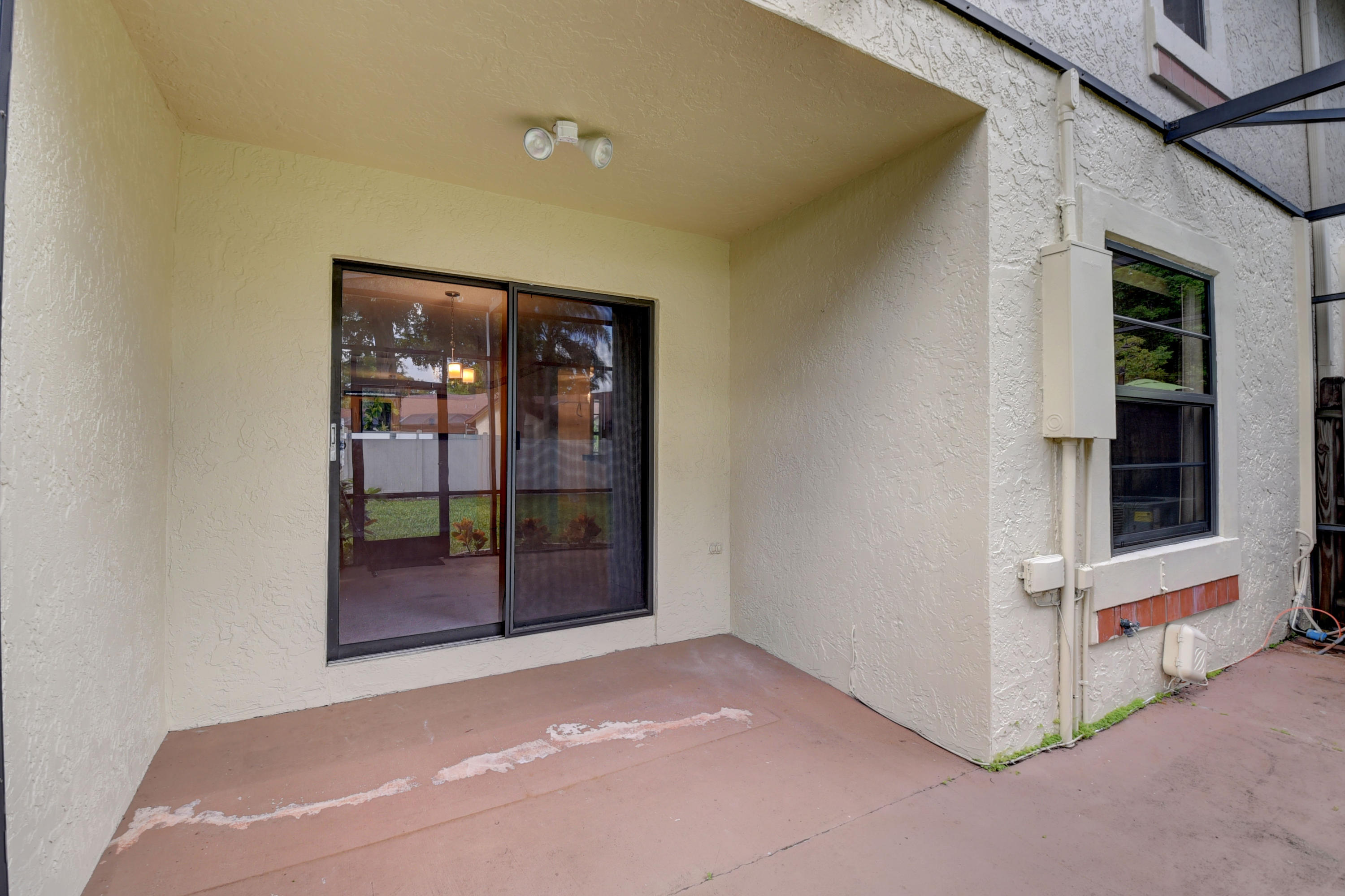 23340 Southwest 53rd Avenue, Unit C Boca Raton, FL 33433 - Photo 27 of 31 Screened In Patio Area