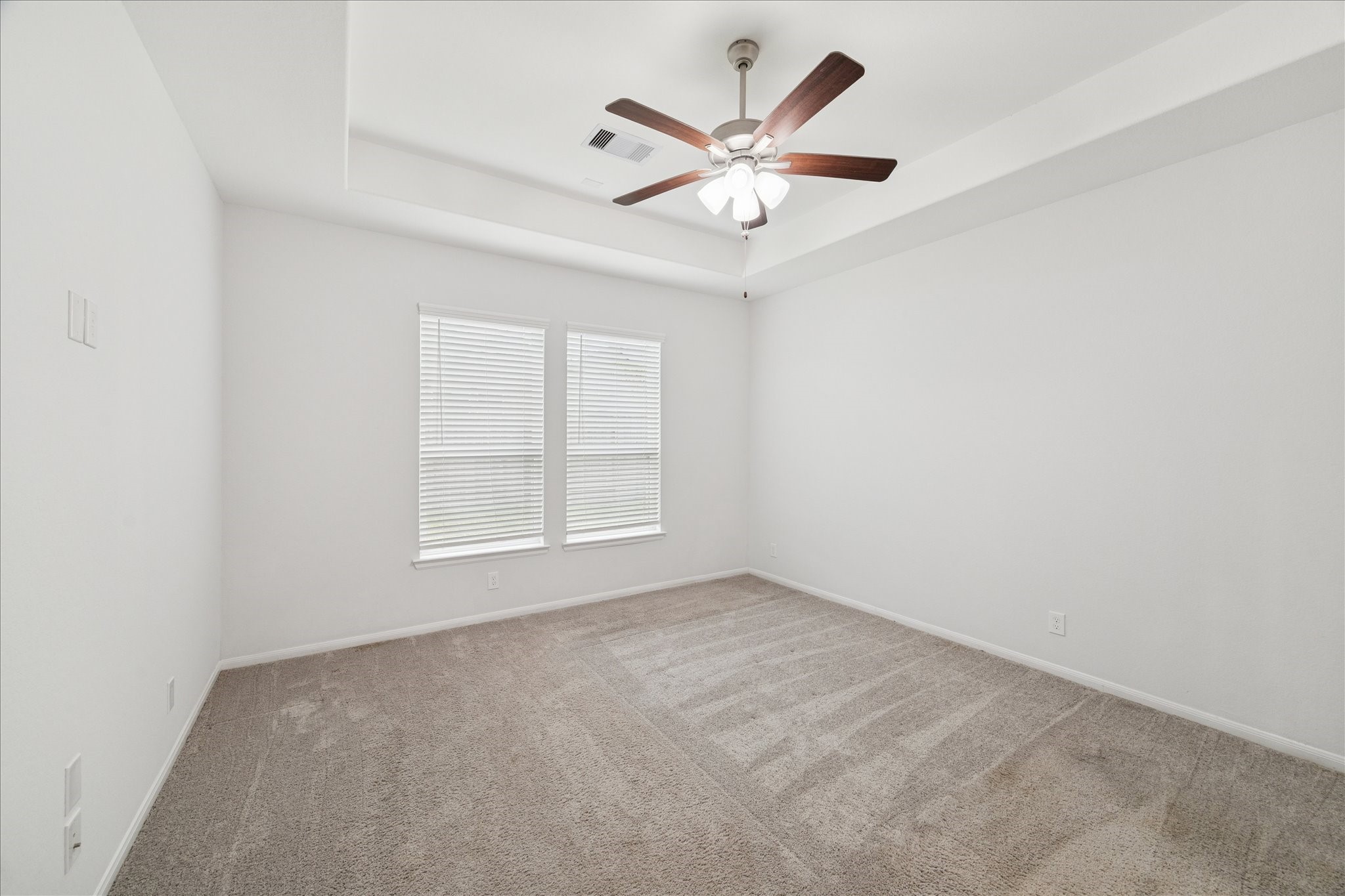 8818 Ruddy Duck Court Baytown, TX 77521 - Photo 18 of 38 A refined and elegant primary suite designed for comfort having extra lighting with this two windows.