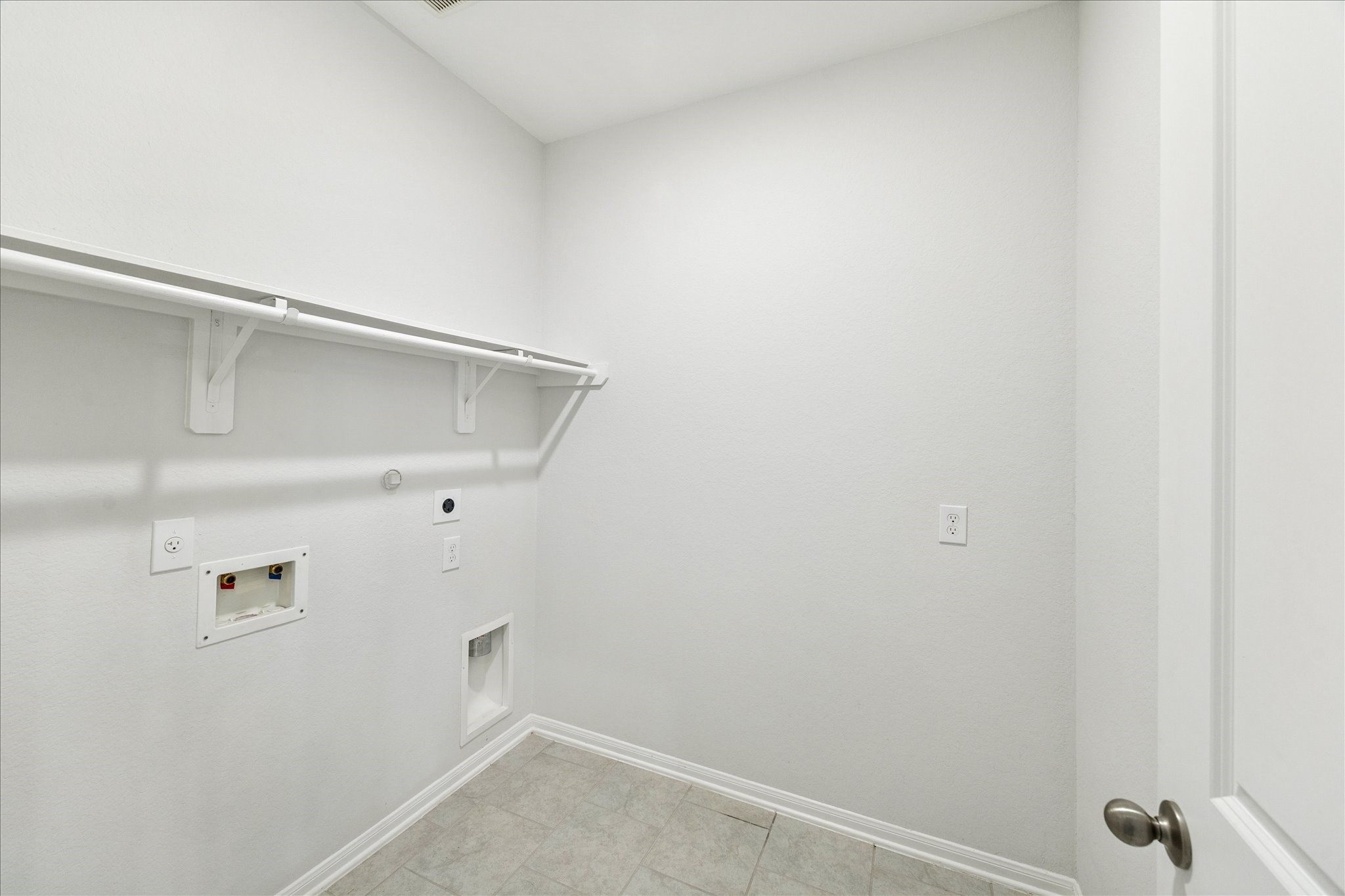 8818 Ruddy Duck Court Baytown, TX 77521 - Photo 30 of 38 Notice the spacious laundry room, offering plenty of room for storage and daily tasks.