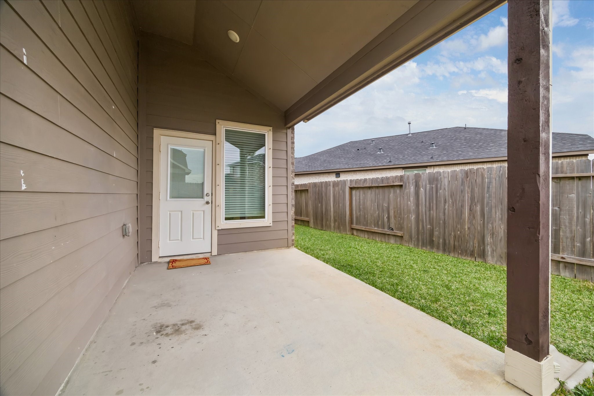 8818 Ruddy Duck Court Baytown, TX 77521 - Photo 33 of 38 A convenient covered patio space, ideal for grilling and outdoor entertaining.