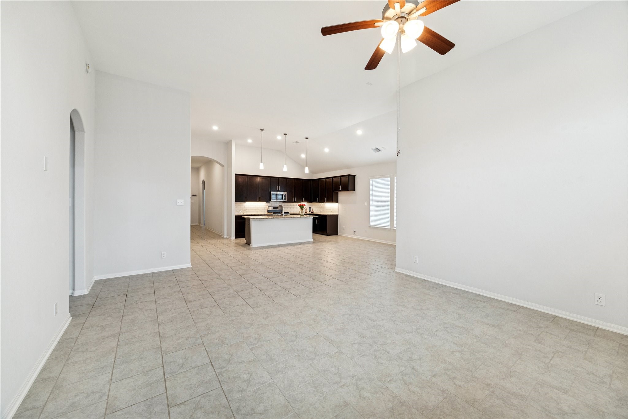 8818 Ruddy Duck Court Baytown, TX 77521 - Photo 37 of 38 A perfect open floor plan crafted for effortless gatherings with family and friends, highlighted by a stunning family room with elegant high ceilings.