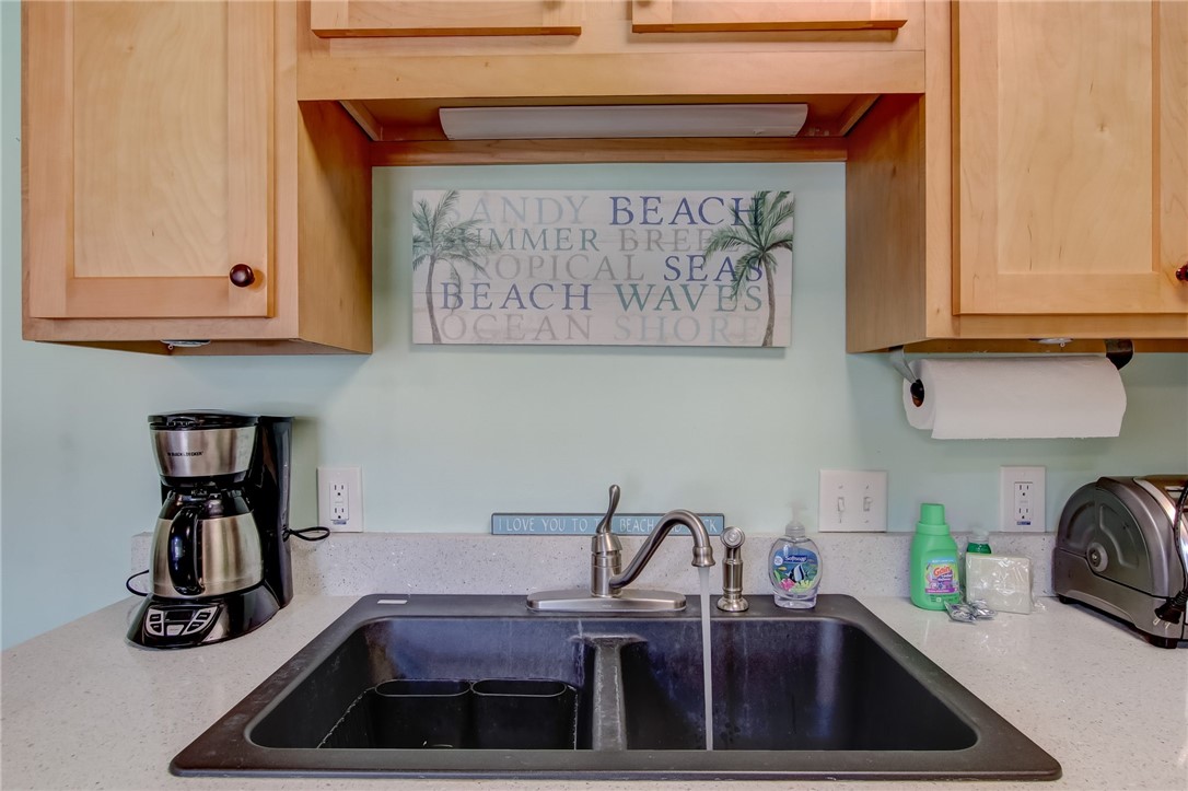 2745 Forest Ridge Drive, Unit I5 Fernandina Beach, FL 32034 - Photo 12 of 32 a kitchen with a sink and cabinets