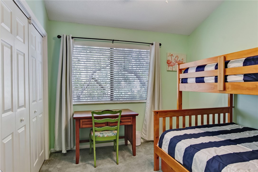 2745 Forest Ridge Drive, Unit I5 Fernandina Beach, FL 32034 - Photo 17 of 32 a bedroom with a bed and a window