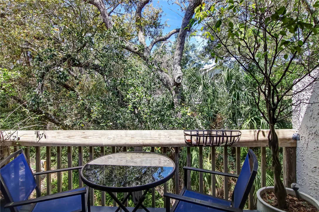 2745 Forest Ridge Drive, Unit I5 Fernandina Beach, FL 32034 - Photo 19 of 32 a view of a chairs and table in the balcony