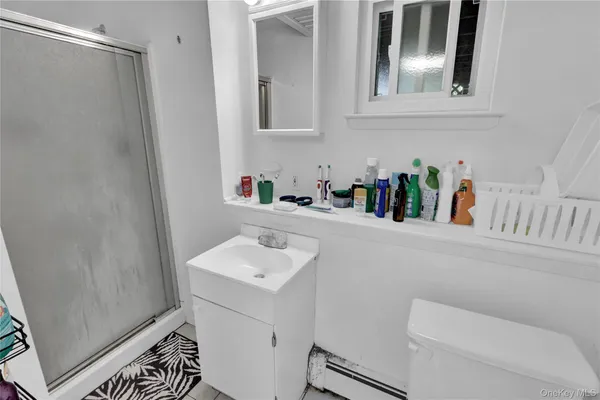 a bathroom with a sink toilet and vanity
