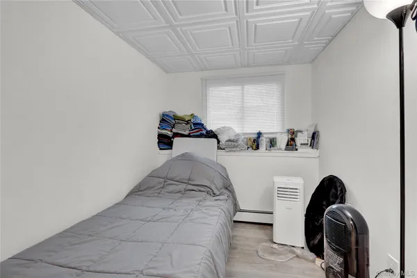 a bedroom with bed and closet