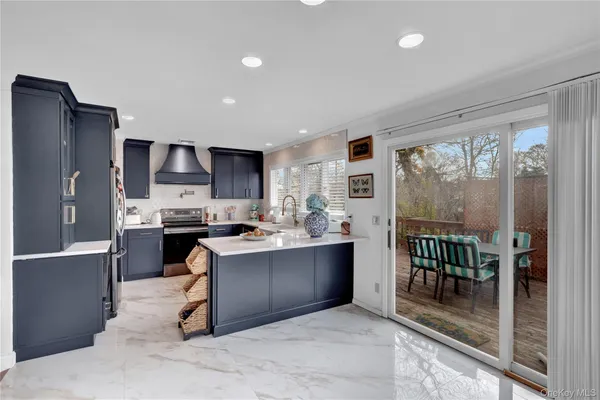 a kitchen with a refrigerator and a sink