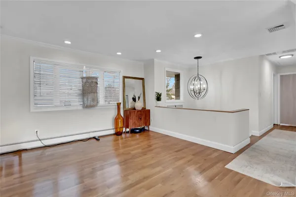 a view of a room with gym equipment and a window