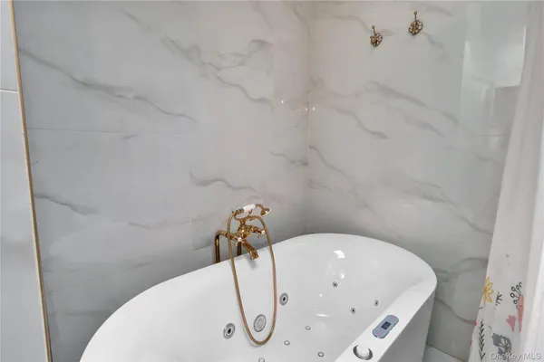 a bathroom with a white tub